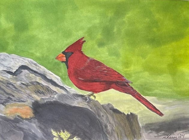 A painting of a red bird on the ground